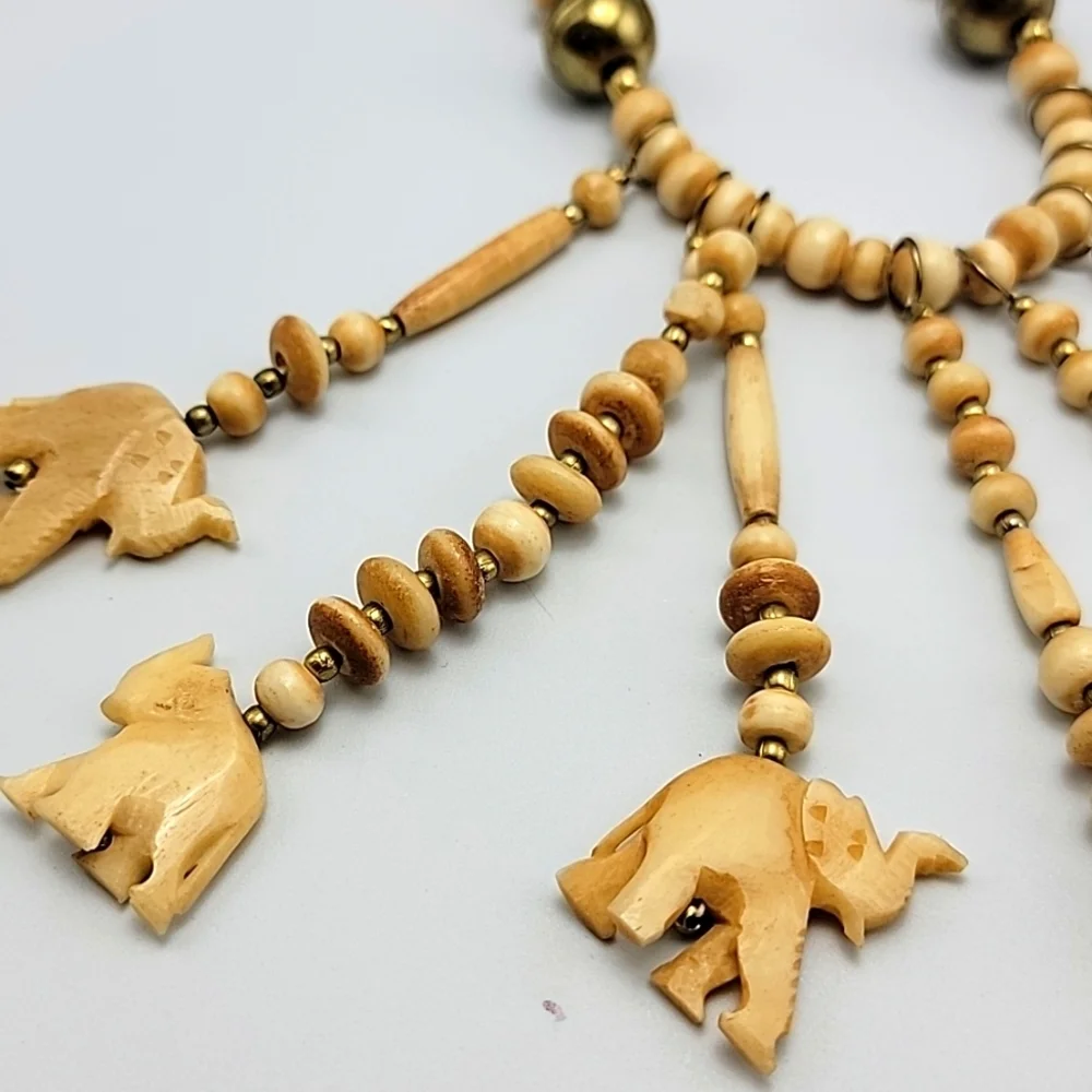 VTG Statement Tribal Bone Bovine Elephant Charm Beaded Gold Tone Necklace Ethnic